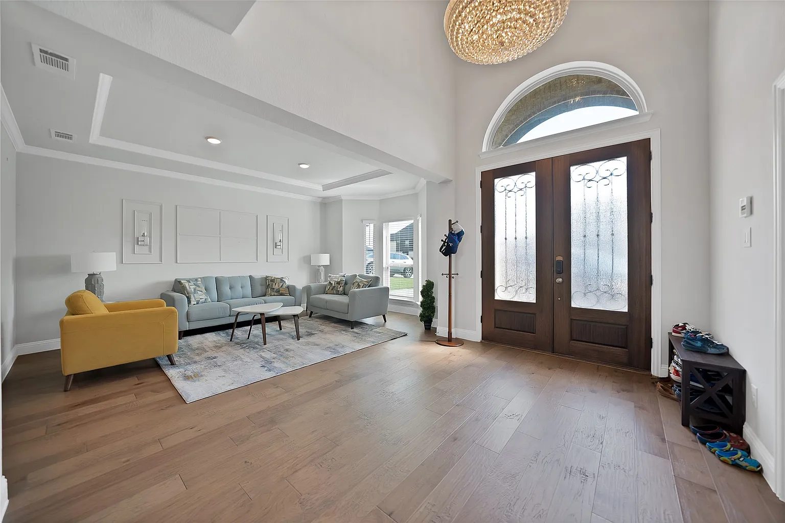 Double front doors and the adjoining furnished sitting area.